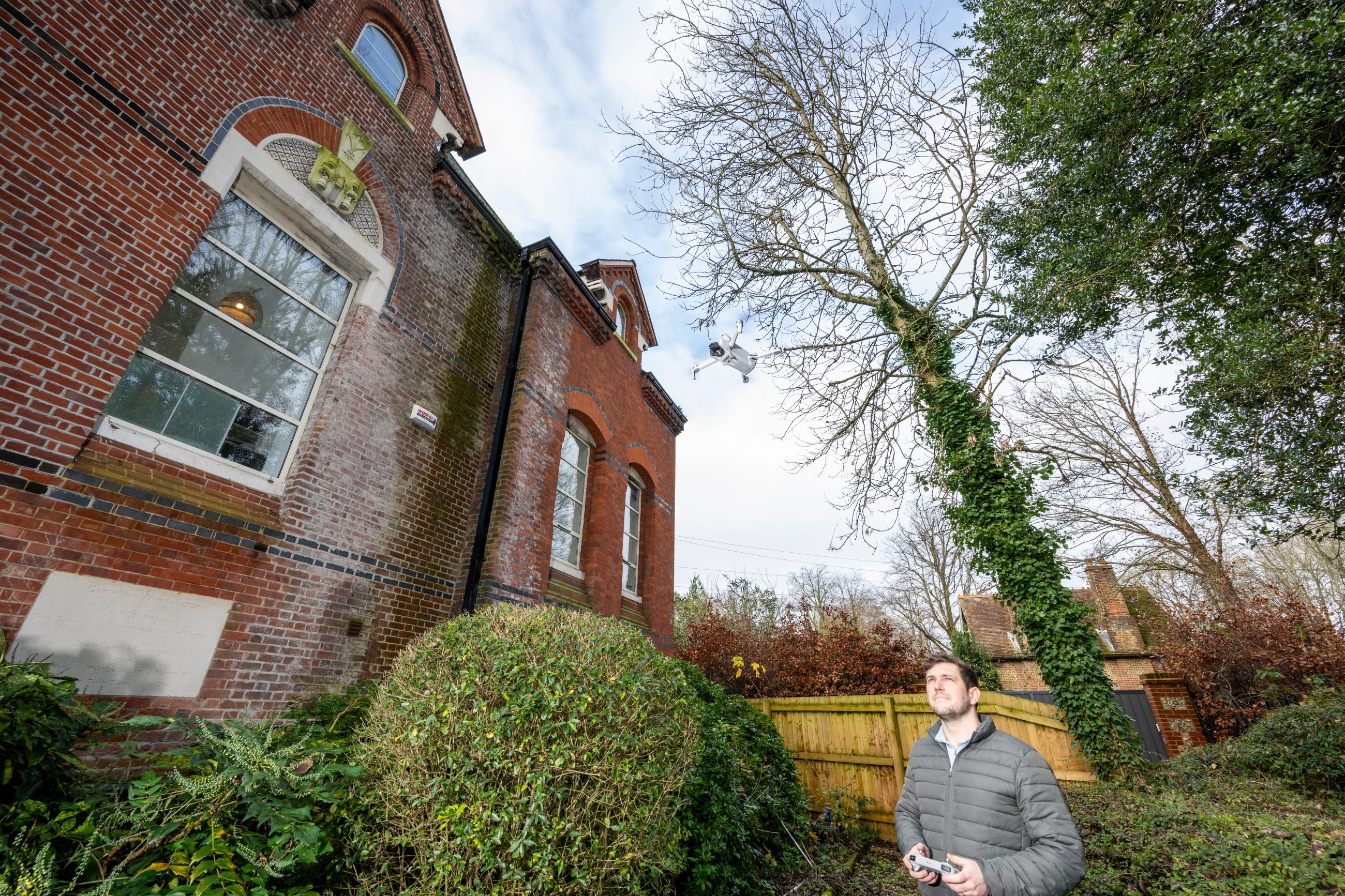 Schedule of condition surveyor inspecting a Southampton commercial building using a mini drone.