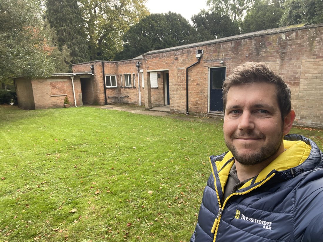 Chartered building surveyor looking at the camera during a dilapidations survey.