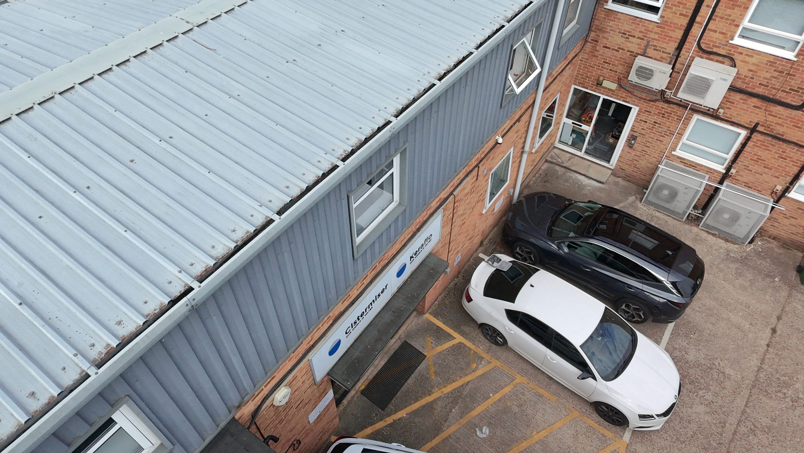 commercial building with cars outside